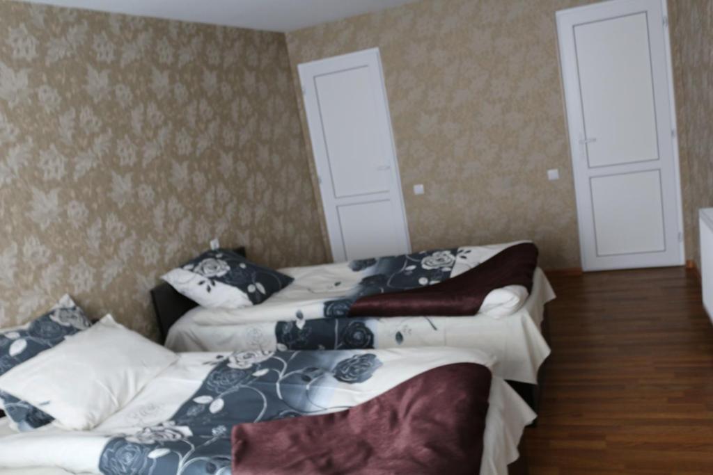Postel nebo postele na pokoji v ubytování Guesthouse suja