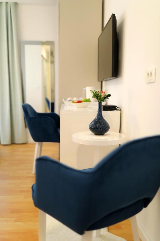 TV a/nebo společenská místnost v ubytování Rosita Deluxe Rooms