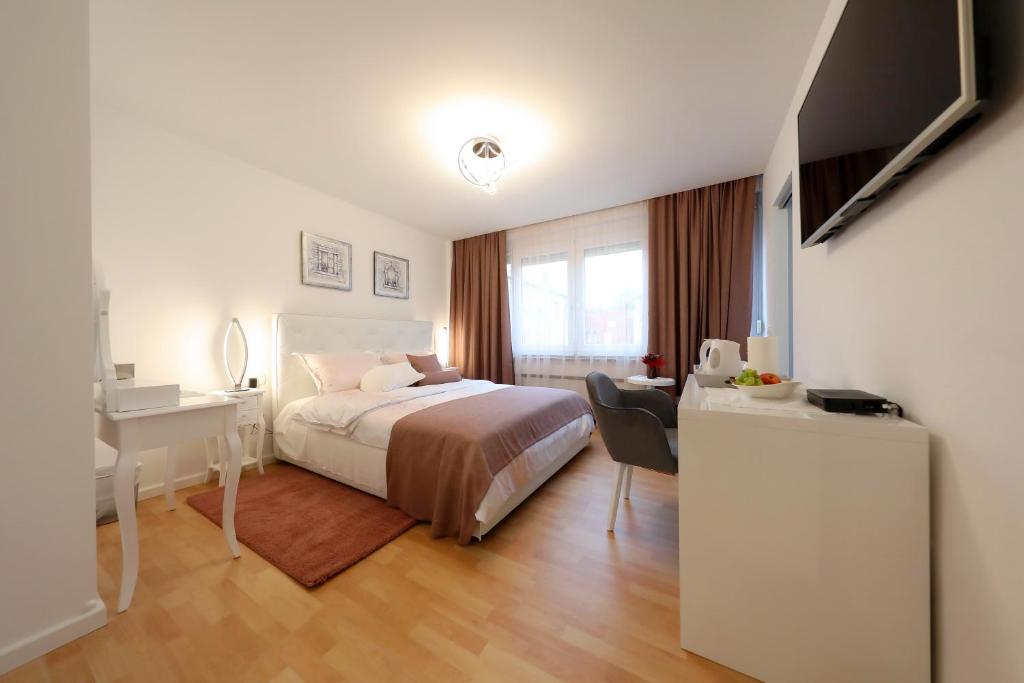Postel nebo postele na pokoji v ubytování Rosita Deluxe Rooms