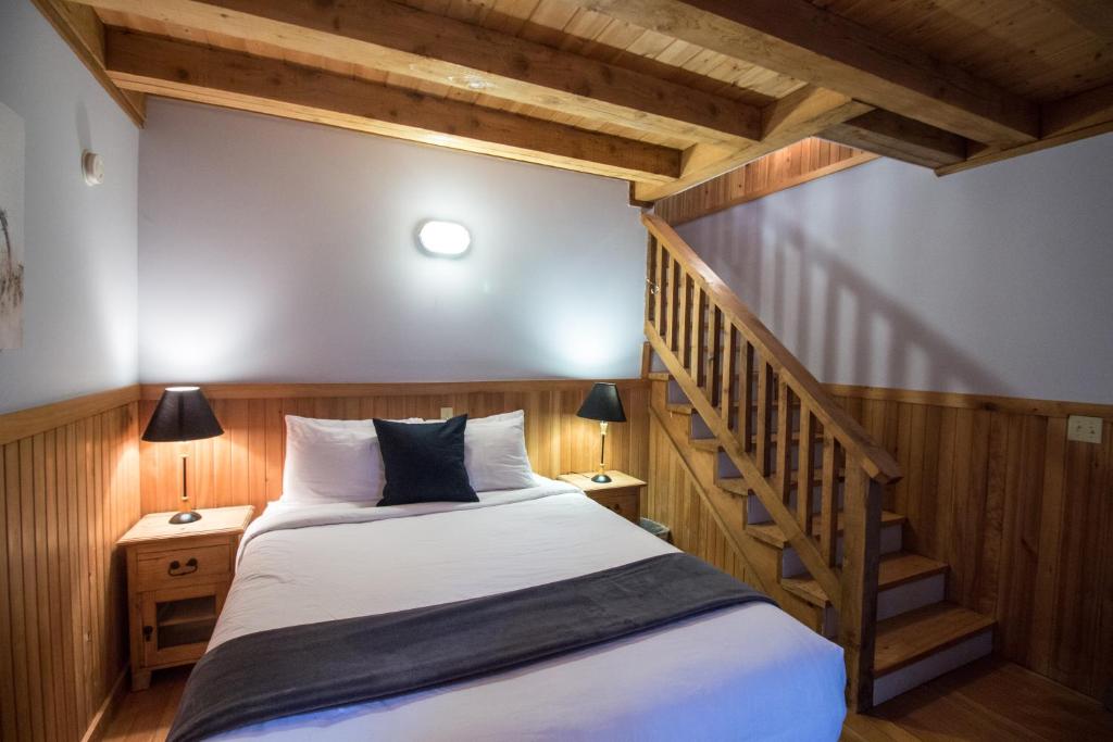 Postel nebo postele na pokoji v ubytování Reef Point Cottages