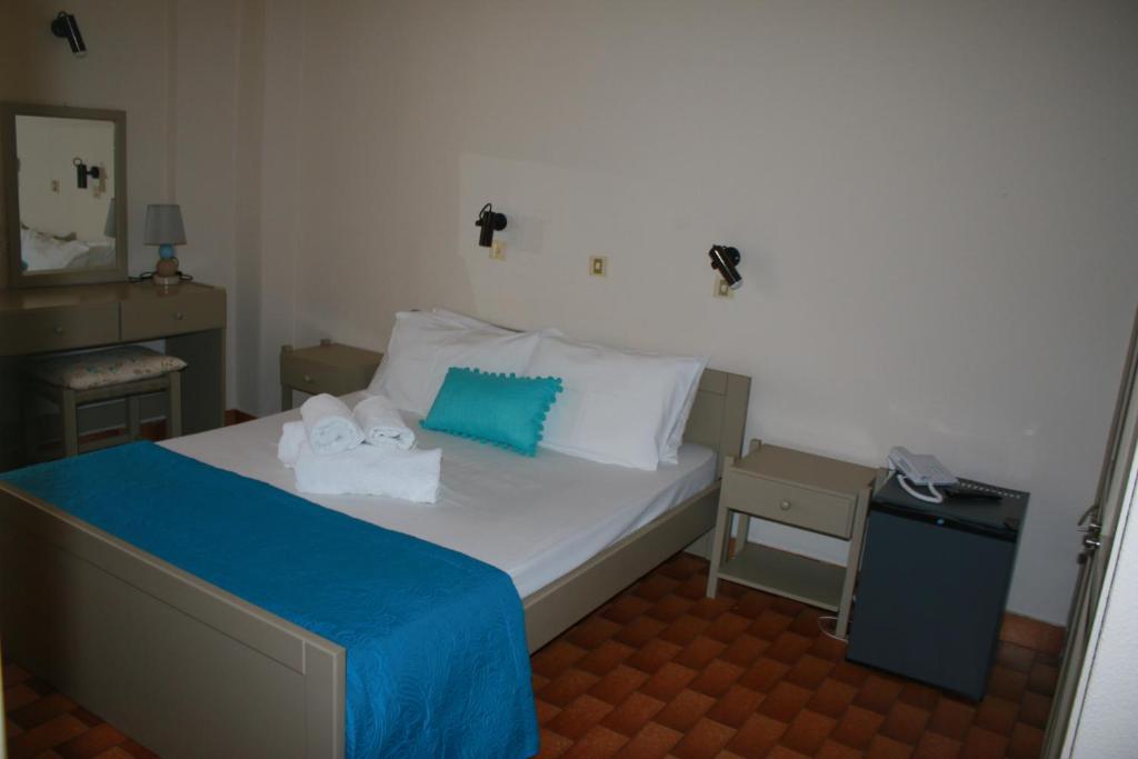 Postel nebo postele na pokoji v ubytování Argostoli Hotel