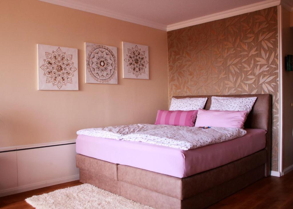 Postel nebo postele na pokoji v ubytování Strandappartement 715 im Plaza Premium Hotel