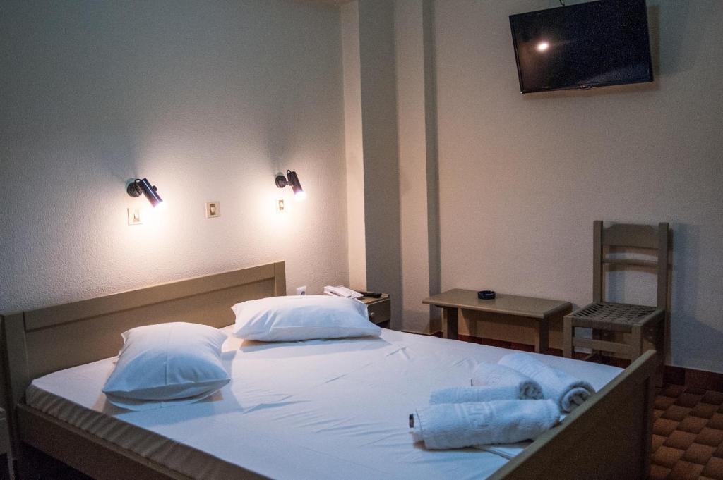 Postel nebo postele na pokoji v ubytování Argostoli Hotel