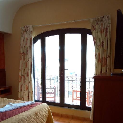Postel nebo postele na pokoji v ubytování Hotel Virreynal