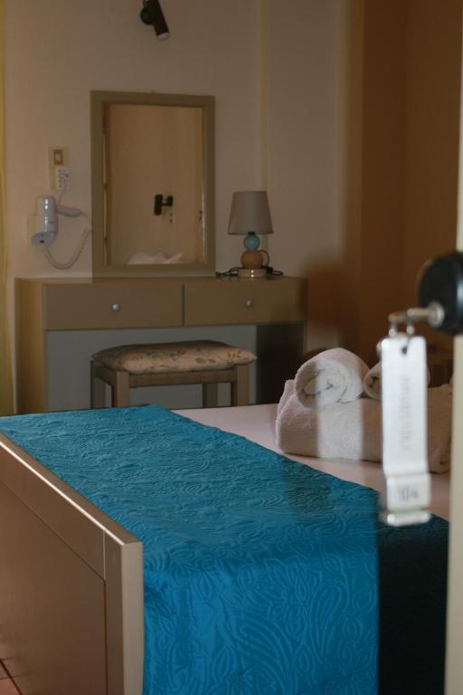 Postel nebo postele na pokoji v ubytování Argostoli Hotel