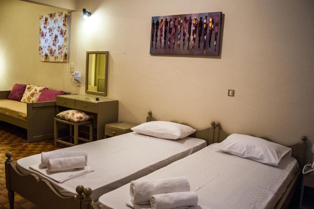 Postel nebo postele na pokoji v ubytování Argostoli Hotel