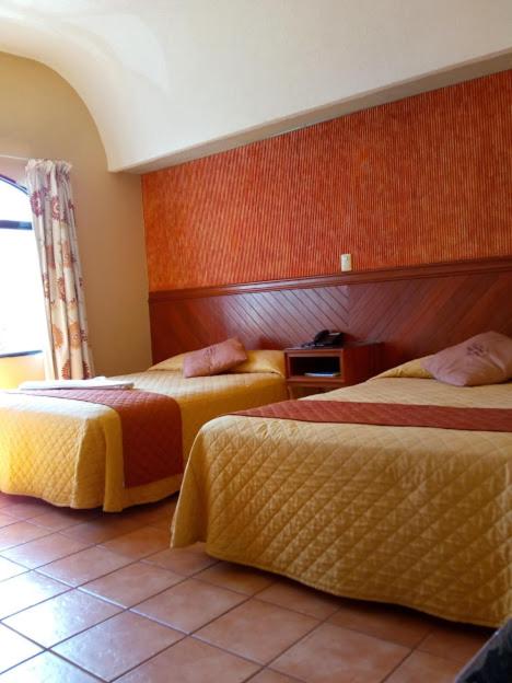 Postel nebo postele na pokoji v ubytování Hotel Virreynal