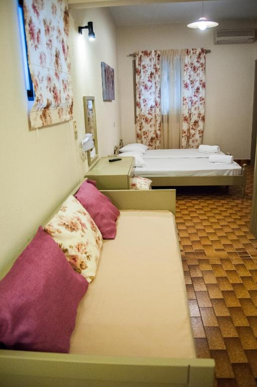 Postel nebo postele na pokoji v ubytování Argostoli Hotel
