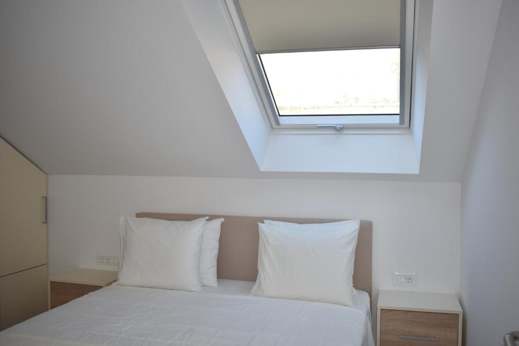 Posteľ alebo postele v izbe v ubytovaní Marlin Apartments