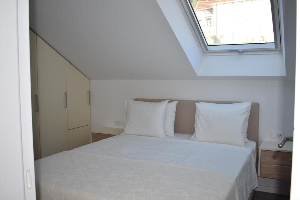 Posteľ alebo postele v izbe v ubytovaní Marlin Apartments
