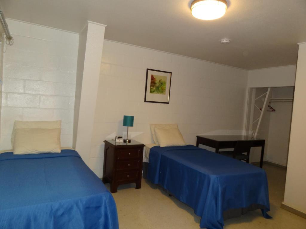 Postel nebo postele na pokoji v ubytování Tip Top Motel