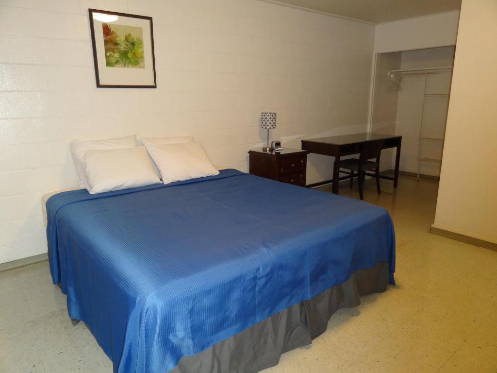 Postel nebo postele na pokoji v ubytování Tip Top Motel
