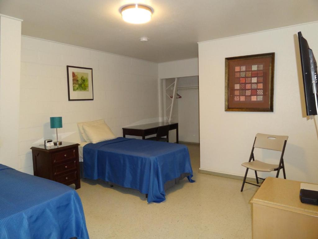 Postel nebo postele na pokoji v ubytování Tip Top Motel