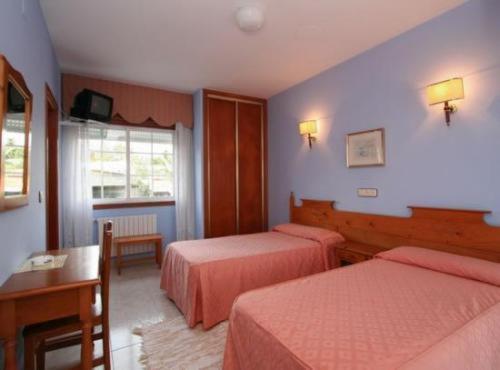 Postel nebo postele na pokoji v ubytování Hotel Vimar
