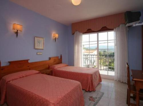 Postel nebo postele na pokoji v ubytování Hotel Vimar