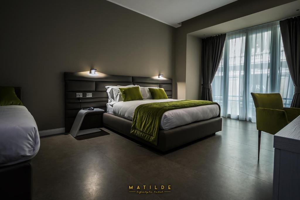 Postel nebo postele na pokoji v ubytování Hotel Matilde - Lifestyle Hotel