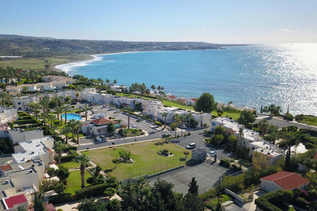 an aerial view of a resort next to the ocean at CORAL BAY suite Cyprus in Coral Bay