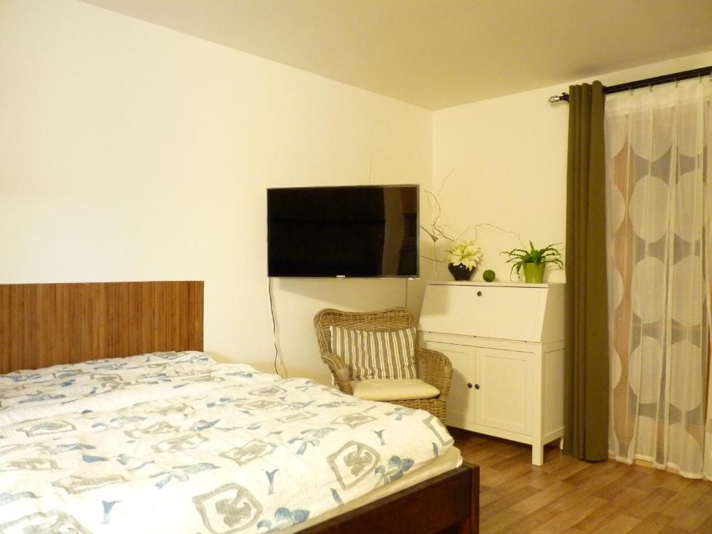 Postel nebo postele na pokoji v ubytování Apartmá Krkonoše