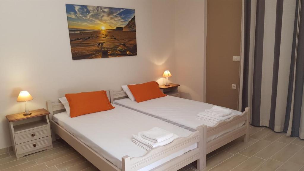 Postel nebo postele na pokoji v ubytování Loggos view apartments