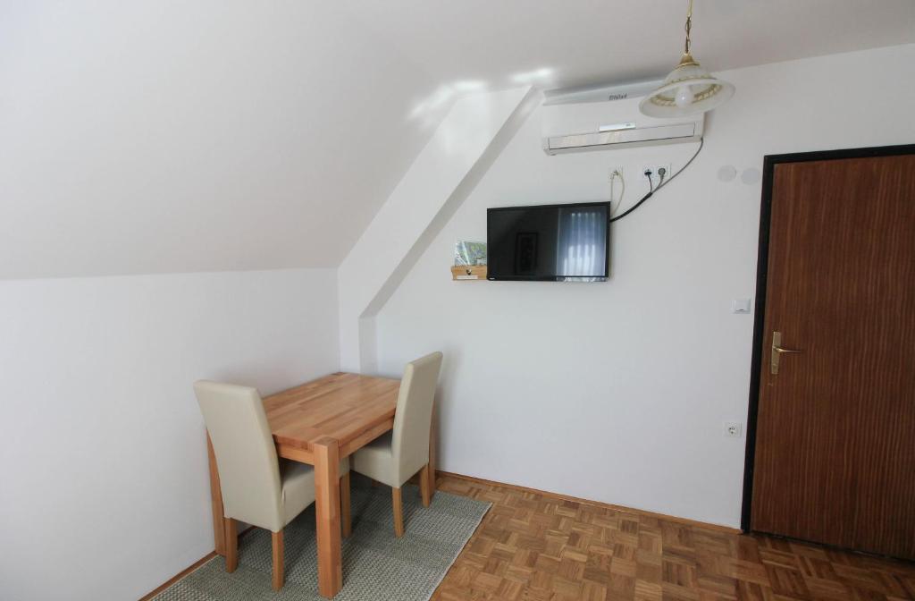 TV a/nebo společenská místnost v ubytování House Milan