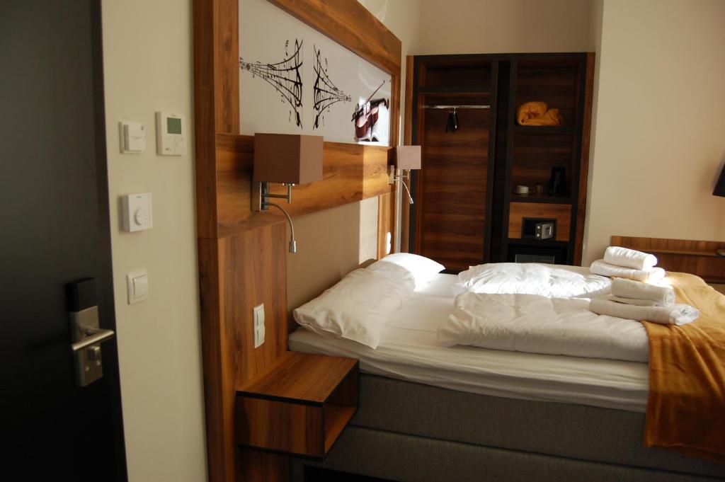 Postel nebo postele na pokoji v ubytování Apollo Hotel Vienna