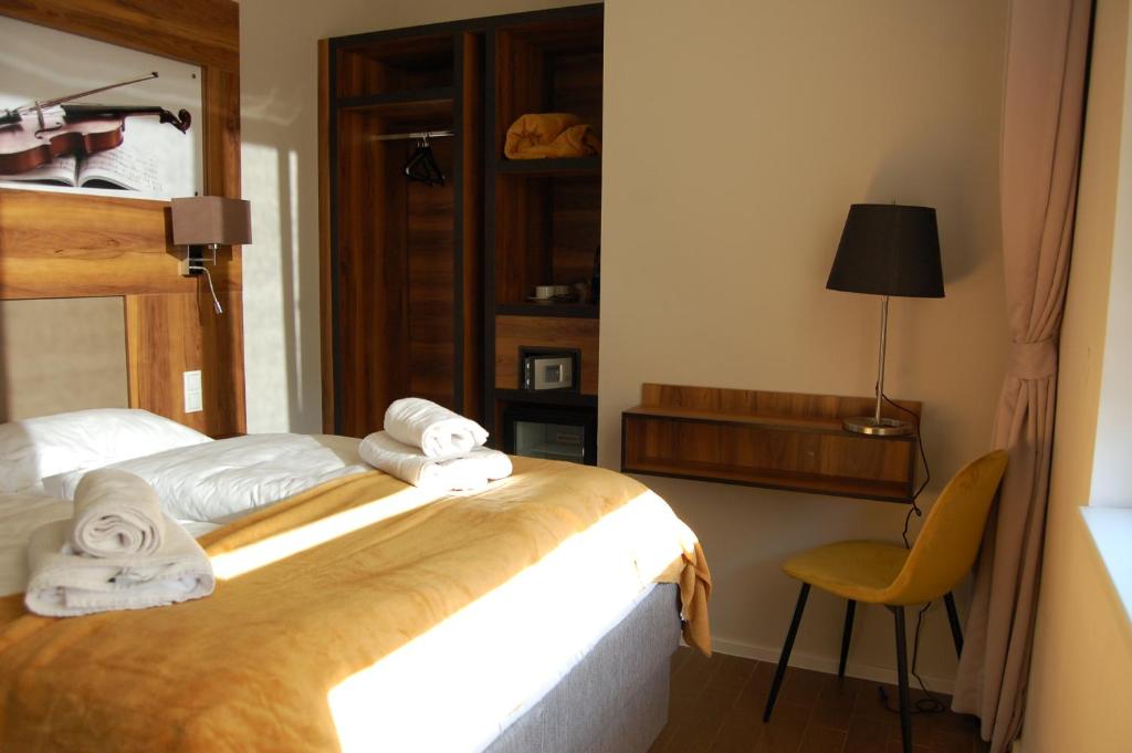 Postel nebo postele na pokoji v ubytování Apollo Hotel Vienna