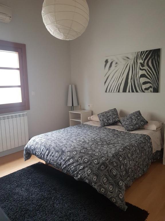 Postel nebo postele na pokoji v ubytování Apartamento Castillo de Arguedas