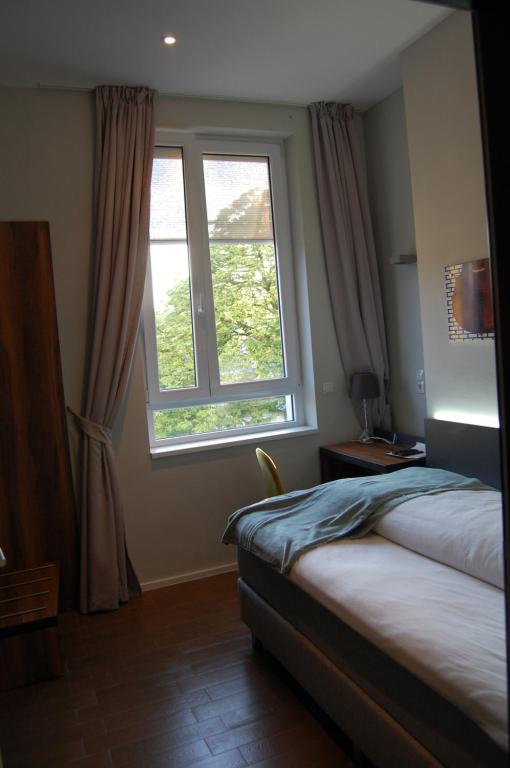 Postel nebo postele na pokoji v ubytování Apollo Hotel Vienna