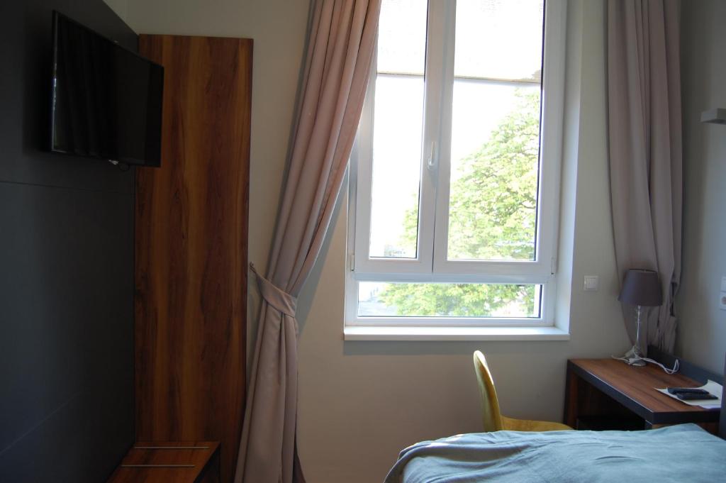 TV a/nebo společenská místnost v ubytování Apollo Hotel Vienna