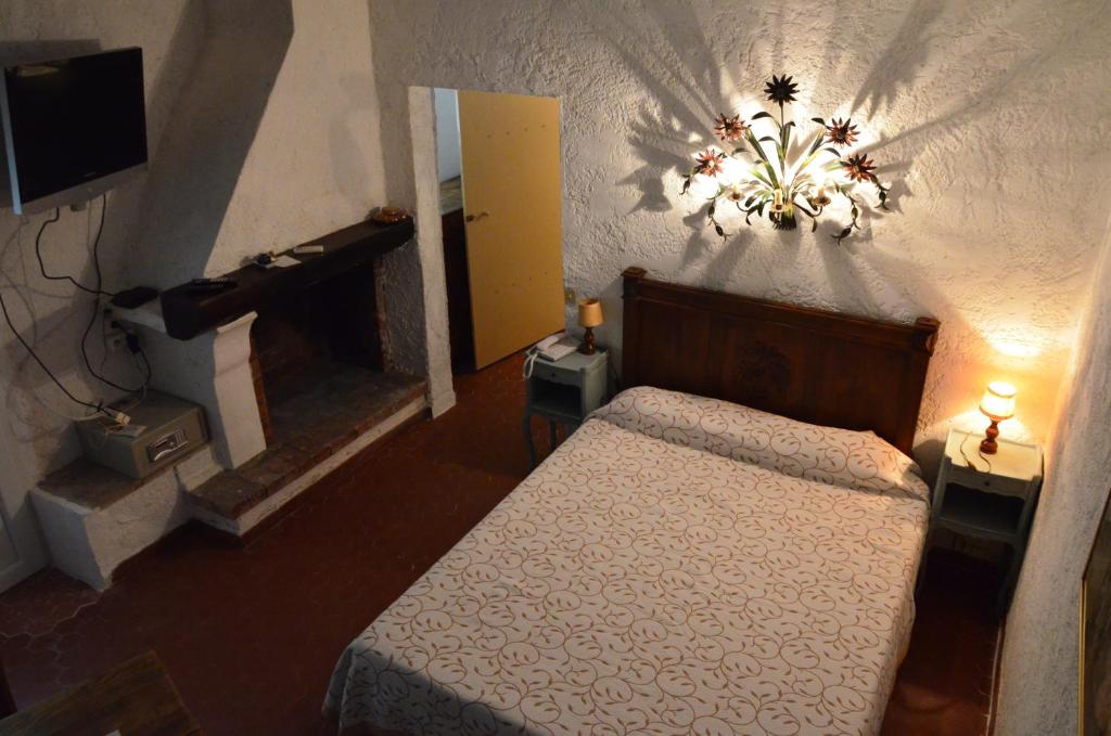 Postel nebo postele na pokoji v ubytování La Pierrerie