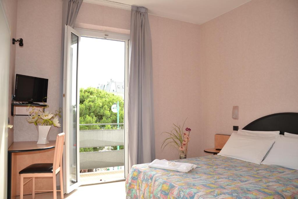 Postel nebo postele na pokoji v ubytování Hotel Belturismo