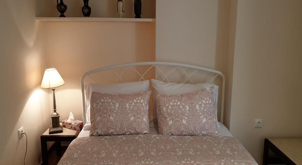 Posteľ alebo postele v izbe v ubytovaní Koukaki apartment near Acropolis