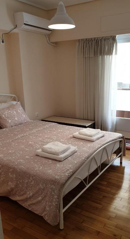 Posteľ alebo postele v izbe v ubytovaní Koukaki apartment near Acropolis