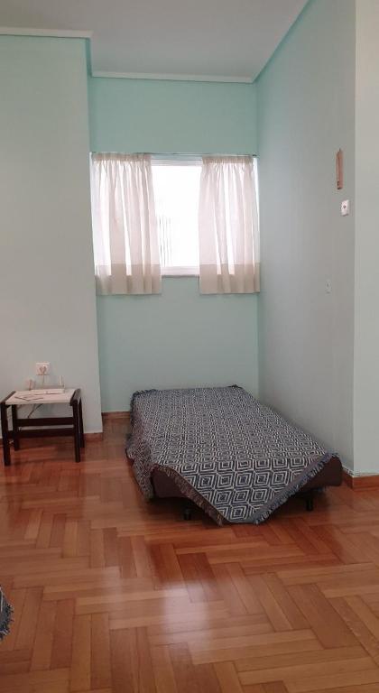 Posteľ alebo postele v izbe v ubytovaní Koukaki apartment near Acropolis