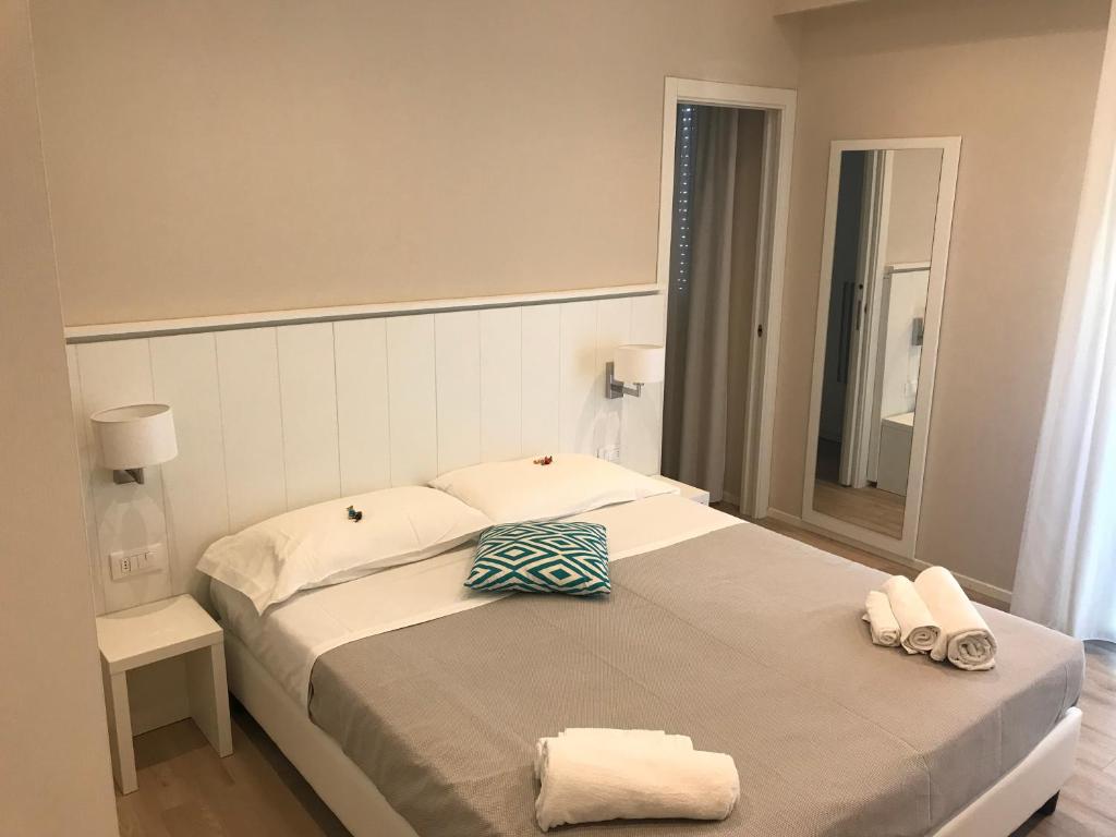 Postel nebo postele na pokoji v ubytování Hotel Vasco