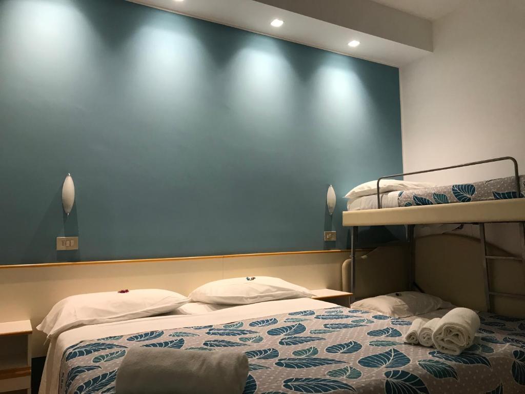 Postel nebo postele na pokoji v ubytování Hotel Vasco