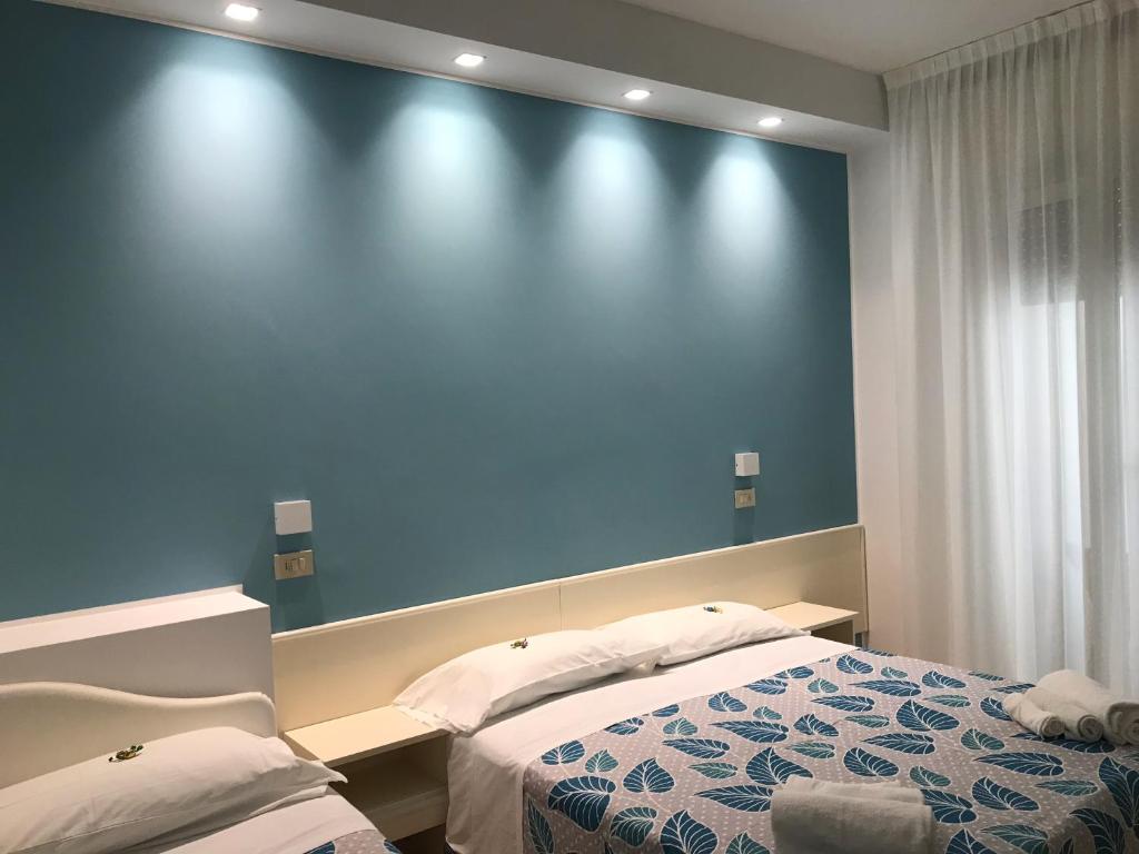 Postel nebo postele na pokoji v ubytování Hotel Vasco