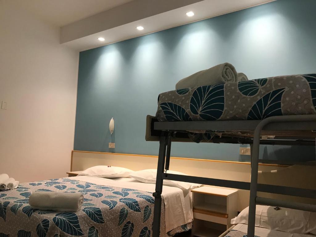 Postel nebo postele na pokoji v ubytování Hotel Vasco