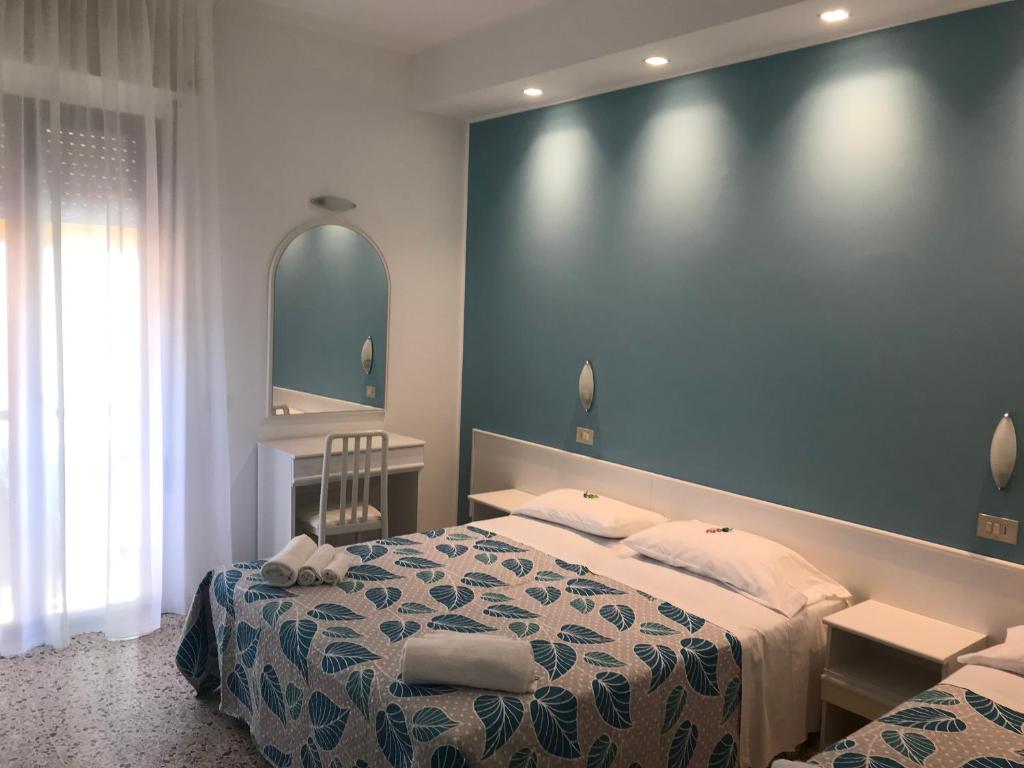 Postel nebo postele na pokoji v ubytování Hotel Vasco