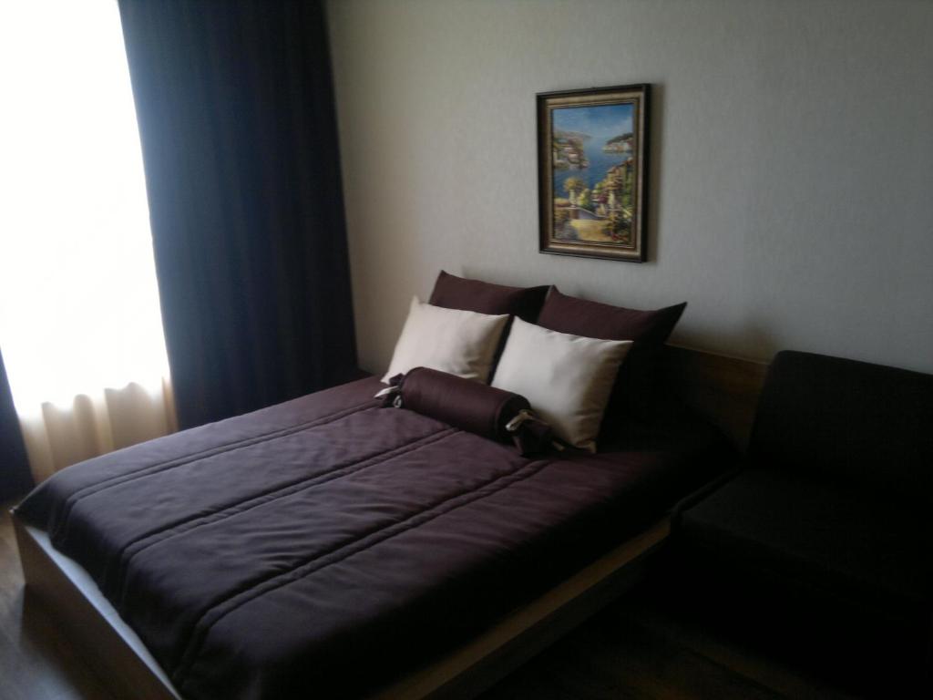 A bed or beds in a room at ApartComplex Splendid - Apartment Romance № 46