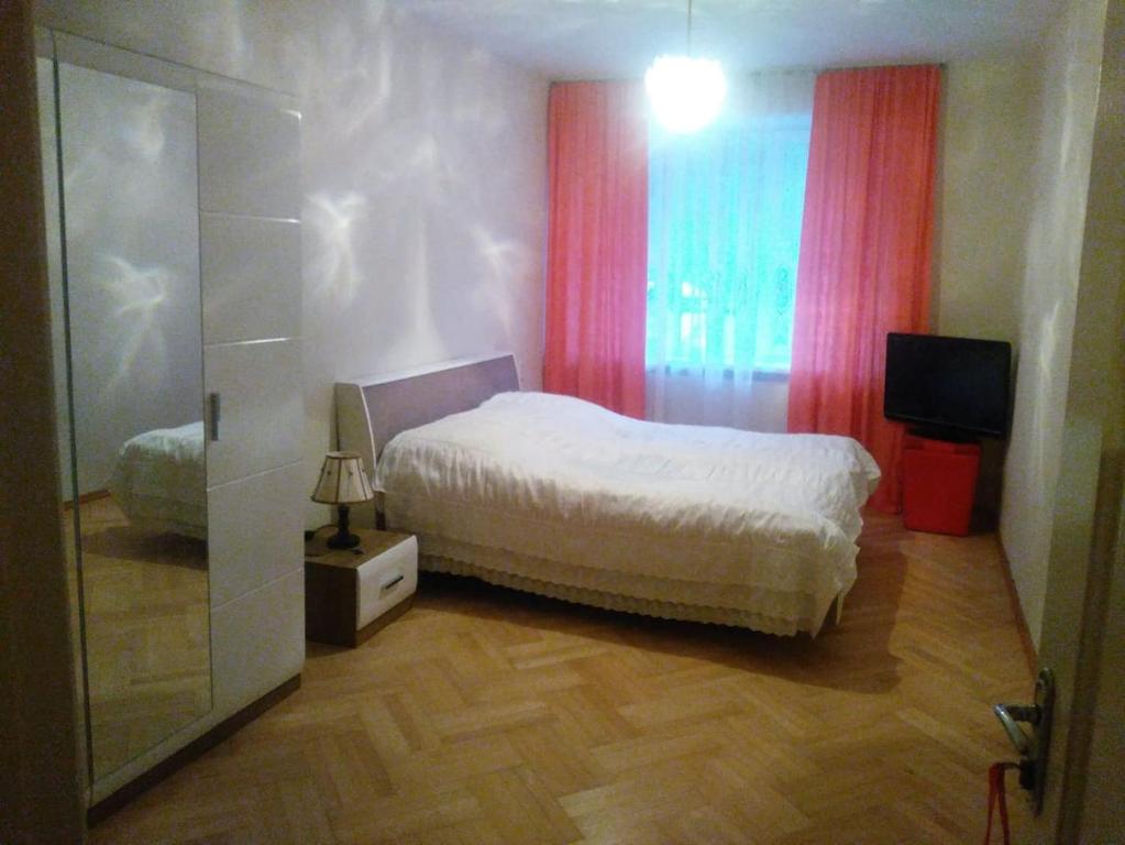 Postel nebo postele na pokoji v ubytování Tbilisi Home