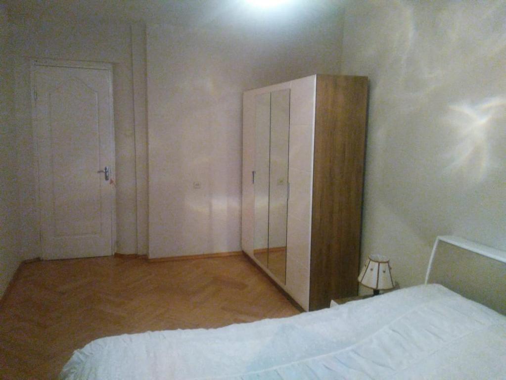 Postel nebo postele na pokoji v ubytování Tbilisi Home