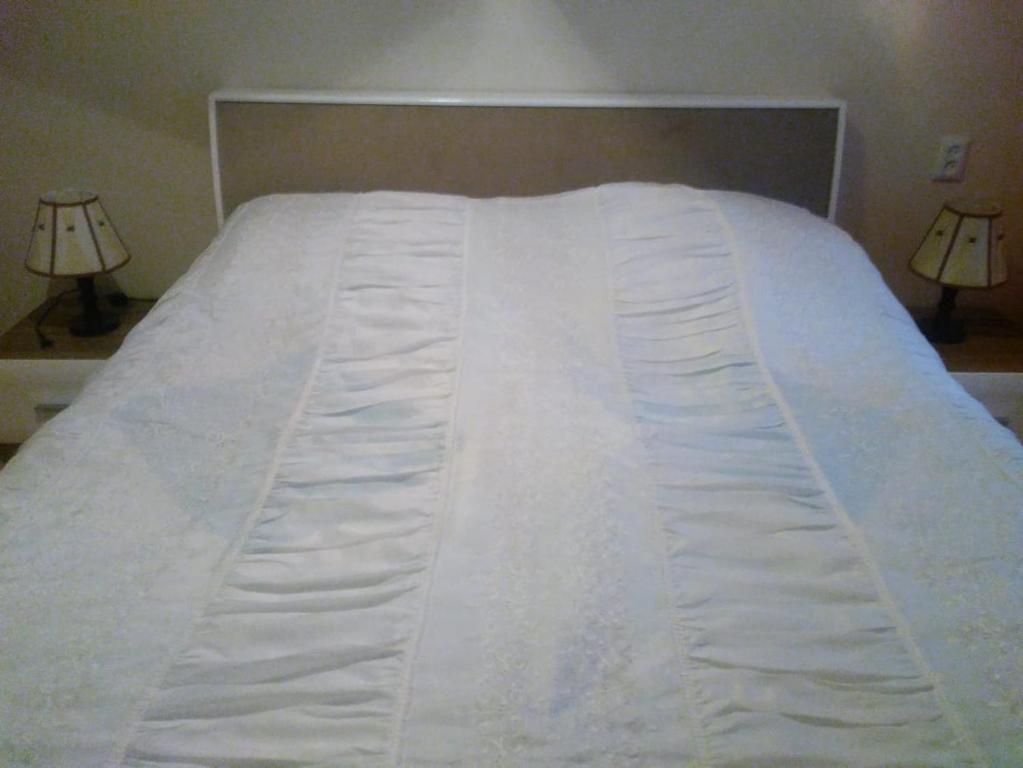 Postel nebo postele na pokoji v ubytování Tbilisi Home