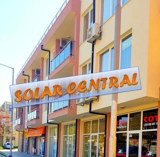 a sodium central sign on a building on a street at Family Hotel Solar Central in Sunny Beach
