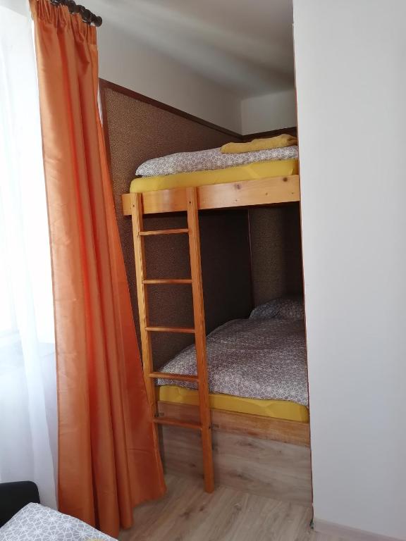 Postel nebo postele na pokoji v ubytování Apartmán Hugo