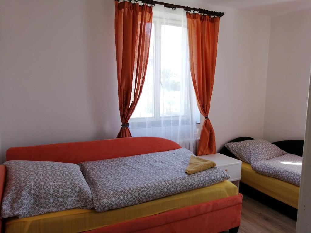 Postel nebo postele na pokoji v ubytování Apartmán Hugo