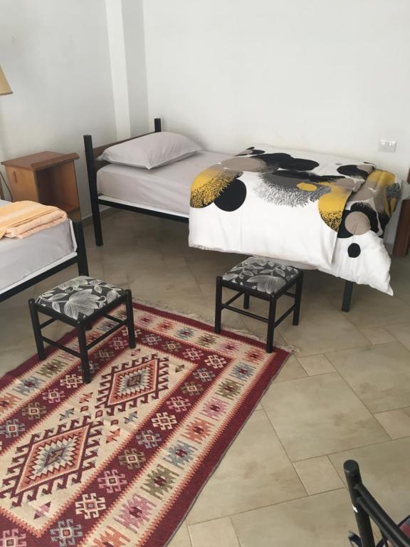 Postel nebo postele na pokoji v ubytování Nina Guest House