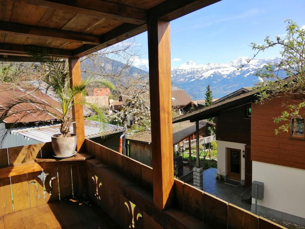 a balcony with a view of the mountains at Niesenblick in Aeschlen ob Gunten