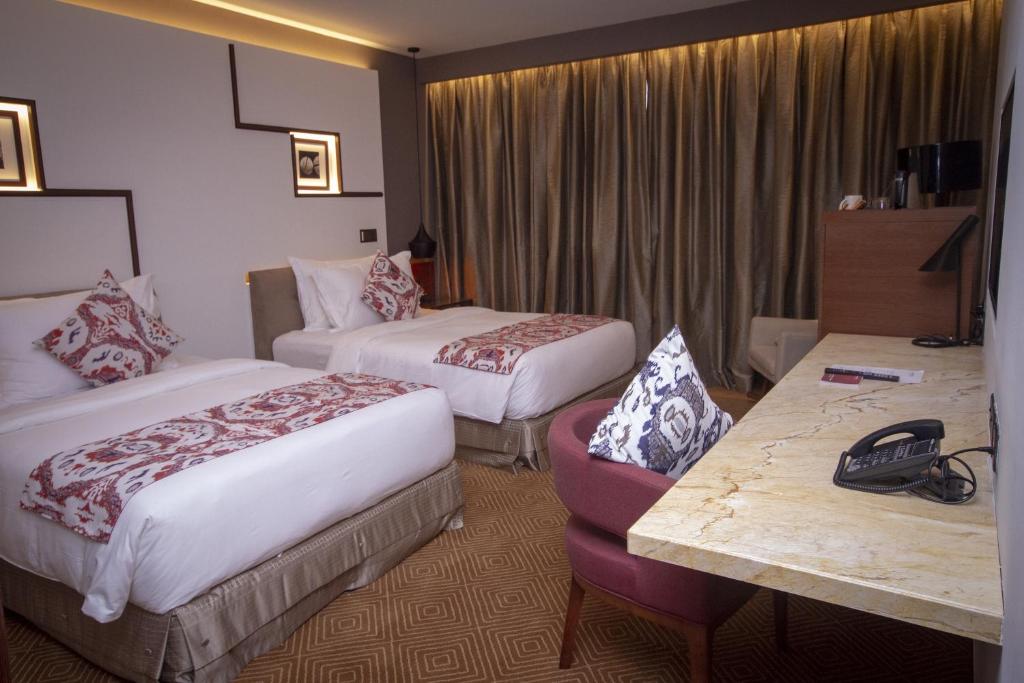 Postel nebo postele na pokoji v ubytování Movenpick Hotel & Convention Centre KLIA