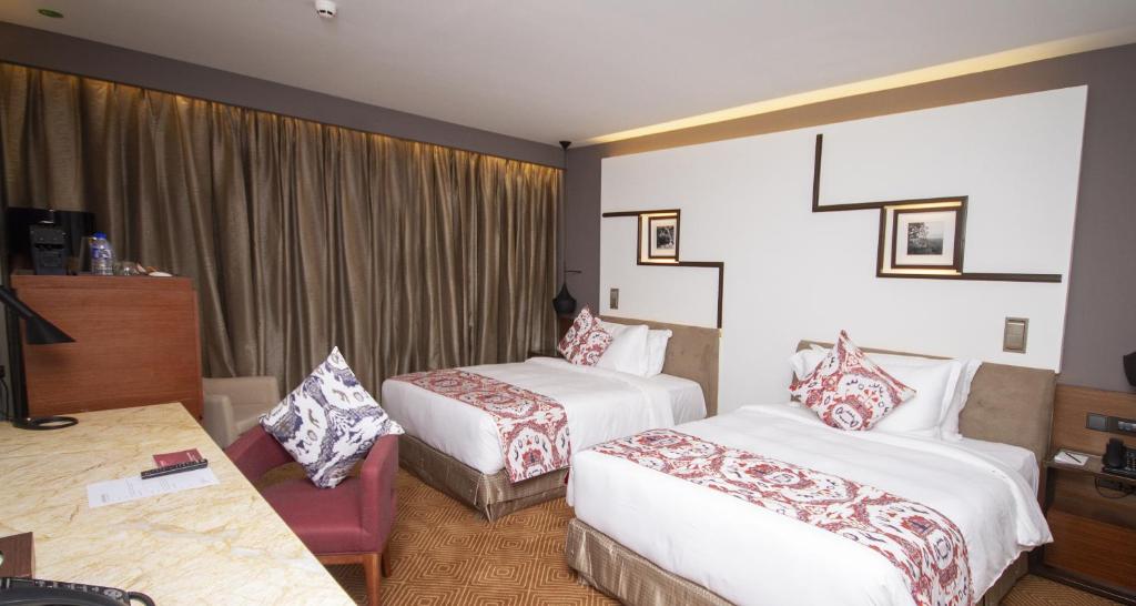 Postel nebo postele na pokoji v ubytování Movenpick Hotel & Convention Centre KLIA